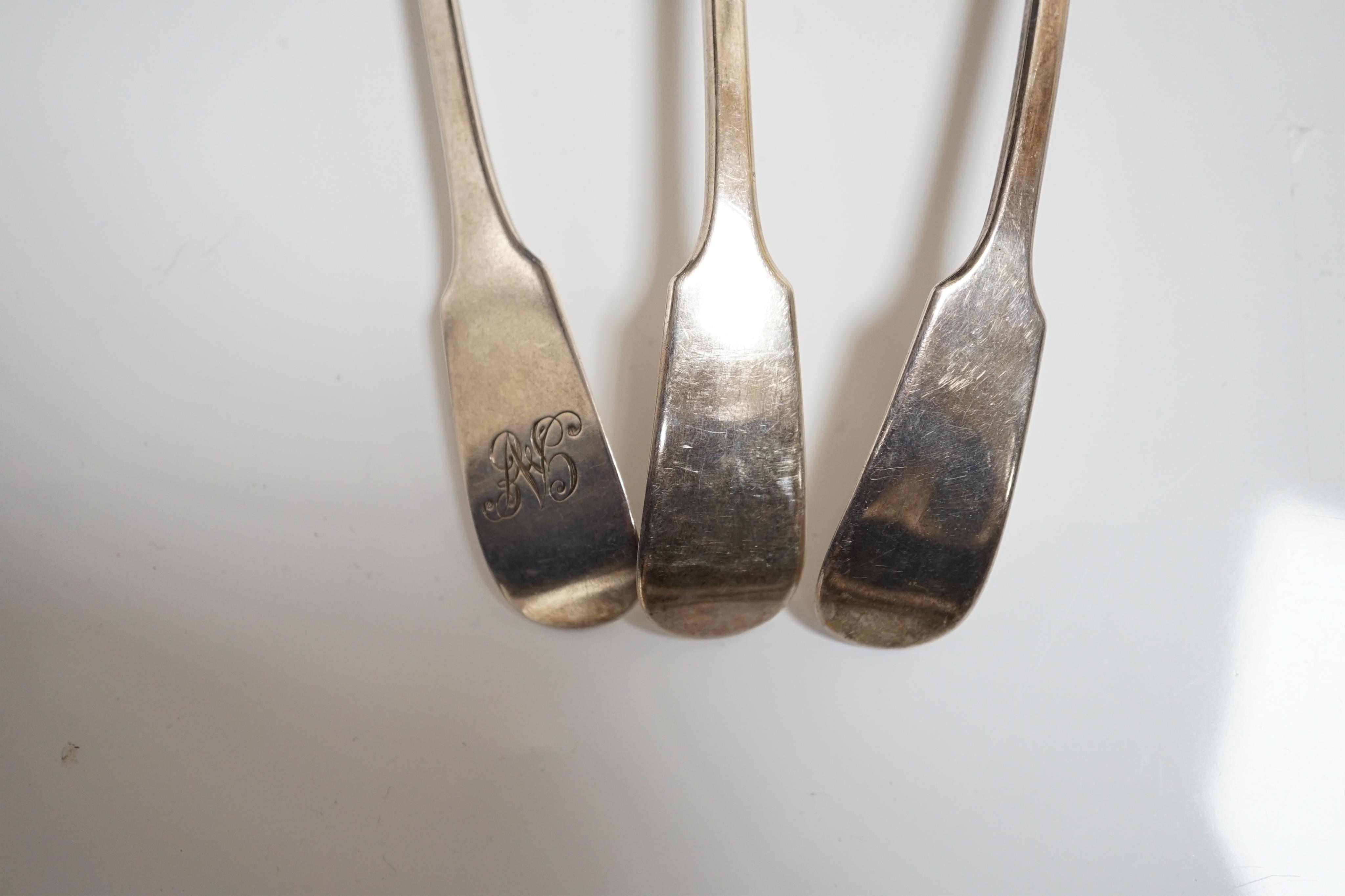 A pair of Victorian silver fiddle pattern sauce ladles, James Wright, Edinburgh, 1862, 15cm, and one other similar unmarked sauce ladle. Condition - fair